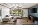Bright living room with a large window, modern ceiling fan, and stylish decor at 2021 Beamguard Rd, Clover, SC 29710