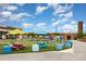 Inviting community area featuring colorful picnic tables, playful decor, and an open-air, friendly atmosphere at 2308 Vanderbilt Rd, Charlotte, NC 28206