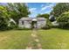 Exterior of a one story home needing renovation and new landscaping at 2308 Vanderbilt Rd, Charlotte, NC 28206