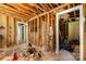 Interior room with exposed studs and unfinished walls showing renovation or construction project at 2308 Vanderbilt Rd, Charlotte, NC 28206