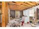 Interior shot of a room showing a washer dryer and unfinished walls indicating a renovation project at 2308 Vanderbilt Rd, Charlotte, NC 28206