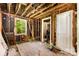 Interior space with exposed studs and unfinished walls highlighting the room's potential at 2308 Vanderbilt Rd, Charlotte, NC 28206