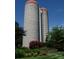 Unique grain silo conversion opportunity for creative home, nestled in the trees with bright blooms at 2408 Salute Blvd, Mint Hill, NC 28227