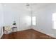 Bedroom featuring hardwood floors, chair, and closet at 2412 Chesterfield Ave, Charlotte, NC 28205
