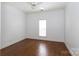 Bright bedroom with hardwood floors, white trim, and ceiling fan at 2412 Chesterfield Ave, Charlotte, NC 28205