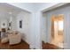 Hallway leading to a bathroom with hardwood floors at 2412 Chesterfield Ave, Charlotte, NC 28205