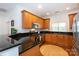 Stylish kitchen featuring stainless steel appliances and granite countertops at 2412 Chesterfield Ave, Charlotte, NC 28205