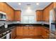 Updated kitchen with stainless steel appliances and wood cabinetry at 2412 Chesterfield Ave, Charlotte, NC 28205