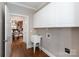 Laundry room featuring a sink, storage, and hardwood floors at 2412 Chesterfield Ave, Charlotte, NC 28205