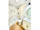 Bright bathroom featuring a stylish marble shower with a modern shower head and elegant vanity at 251 Hall Nw Ave, Concord, NC 28027