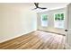 Bedroom with two large windows providing natural light, plus ceiling fan at 251 Hall Nw Ave, Concord, NC 28027