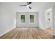 Well-lit bedroom showing wood floors, bright windows, and an attached bathroom at 251 Hall Nw Ave, Concord, NC 28027
