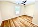 Neutral bedroom featuring a modern ceiling fan and a large window providing natural light and a pleasant view at 251 Hall Nw Ave, Concord, NC 28027