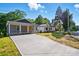 Charming gray home with a long driveway and inviting curb appeal at 251 Hall Nw Ave, Concord, NC 28027