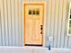 A close-up view of the exterior front door with a glass window at 251 Hall Nw Ave, Concord, NC 28027