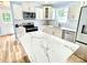 Kitchen boasts quartz countertops, stainless steel appliances, and stylish backsplash at 251 Hall Nw Ave, Concord, NC 28027