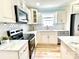 A detailed shot of a modern kitchen with stainless appliances and an island at 251 Hall Nw Ave, Concord, NC 28027