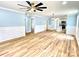 A spacious living room with beautiful hardwood flooring and blue paint at 251 Hall Nw Ave, Concord, NC 28027