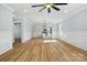 Spacious living room with light blue walls and an open layout to the kitchen at 251 Hall Nw Ave, Concord, NC 28027