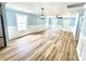 Spacious living room with wainscotting, modern lighting, and ample natural light at 251 Hall Nw Ave, Concord, NC 28027