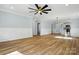 Open concept living room featuring beautiful floors and views of the kitchen at 251 Hall Nw Ave, Concord, NC 28027