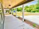 View of a covered porch with concrete floor and nice landscaping at 251 Hall Nw Ave, Concord, NC 28027
