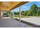Under the covered porch, looking towards the street, showing the beautiful landscape at 251 Hall Nw Ave, Concord, NC 28027
