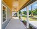 Under the covered porch, looking towards the street, lush landscaping visible at 251 Hall Nw Ave, Concord, NC 28027