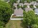 Home and fenced-in backyard highlighted in aerial view with lush lawn, trees, and landscaping at 2598 Old Ashworth Nw Ln, Concord, NC 28027