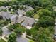 A beautiful aerial shot of a suburban home with mature trees, landscaping, and a fenced backyard at 2598 Old Ashworth Nw Ln, Concord, NC 28027