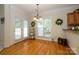 Bright dining area with hardwood floors, natural light, and access to the backyard at 2598 Old Ashworth Nw Ln, Concord, NC 28027