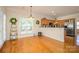 Bright dining area with hardwood floors, natural light, and access to the backyard and kitchen at 2598 Old Ashworth Nw Ln, Concord, NC 28027