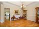 The dining room offers hardwood floors, soft neutral walls, crown moulding, and is brightly lit by a chandelier at 2598 Old Ashworth Nw Ln, Concord, NC 28027