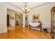 Bright dining room with gleaming hardwood floors, crown molding, and a seamless transition to other living areas in the home at 2598 Old Ashworth Nw Ln, Concord, NC 28027