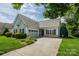 Home with well-kept lawn, shrubbery, two-car garage and lovely covered entryway at 2598 Old Ashworth Nw Ln, Concord, NC 28027
