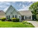 Charming single-story home boasts manicured lawn, fresh landscaping and a cozy, inviting facade on a bright, sunny day at 2598 Old Ashworth Nw Ln, Concord, NC 28027