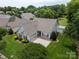 Charming home with well-maintained lawn, manicured shrubs, and an attached two-car garage at 2598 Old Ashworth Nw Ln, Concord, NC 28027