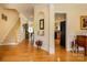 The open foyer showcases hardwood floors, a staircase to the upper level, and seamless flow into adjacent living spaces at 2598 Old Ashworth Nw Ln, Concord, NC 28027