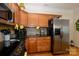 Charming kitchen features granite countertops, stainless steel appliances, and wood cabinetry at 2598 Old Ashworth Nw Ln, Concord, NC 28027
