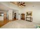 Open living room with large window, hardwood floors and view to second floor at 2598 Old Ashworth Nw Ln, Concord, NC 28027