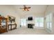 Cozy living room features a fireplace, ceiling fan, and plenty of natural light at 2598 Old Ashworth Nw Ln, Concord, NC 28027