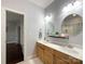 Bathroom with a double vanity, two mirrors, and good lighting fixtures at 2652 Bedford Nw Pl, Concord, NC 28027