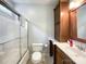 Bathroom features a shower and a single vanity with wooden cabinets and tiled floor at 2652 Bedford Nw Pl, Concord, NC 28027