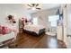 Well-lit bedroom with hardwood floors, ceiling fan, and ample space at 2652 Bedford Nw Pl, Concord, NC 28027