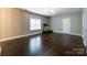 Spacious bonus room featuring hardwood floors, a treadmill, recessed lighting, and natural light from a window at 2652 Bedford Nw Pl, Concord, NC 28027