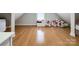 Spacious bonus room with wood floors featuring a window and space for storage or play at 2652 Bedford Nw Pl, Concord, NC 28027
