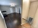 Expansive bonus room with hardwood floors, recessed lighting, multiple doorways, and stairway access at 2652 Bedford Nw Pl, Concord, NC 28027