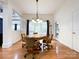 This dining area features a unique poker table and adjacent light fixture at 2652 Bedford Nw Pl, Concord, NC 28027