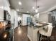 Spacious kitchen with an island, black countertops, and stainless steel appliances at 2652 Bedford Nw Pl, Concord, NC 28027