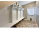 Organized mud room featuring built-in lockers and storage with direct access to the outside at 2652 Bedford Nw Pl, Concord, NC 28027